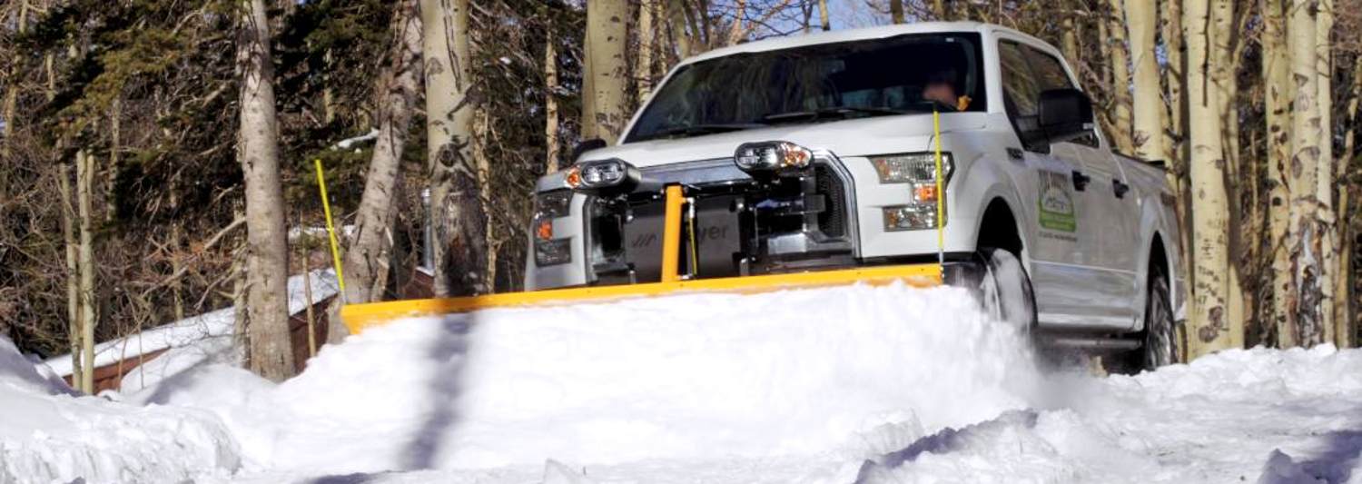 Meyer Drive Pro Snowplow Pushing Snow Mounted on a Pickup Truck